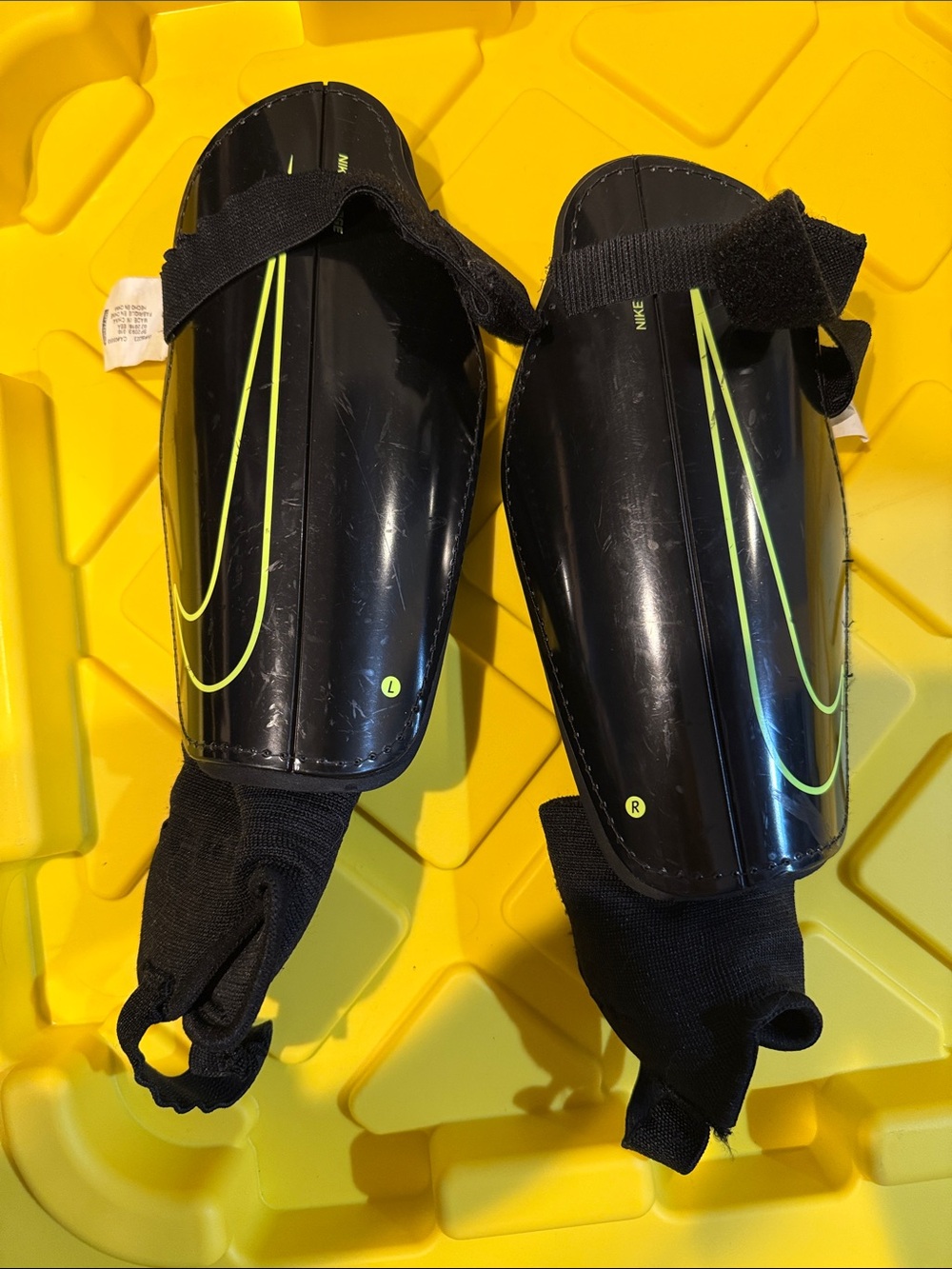 Nike Black Shin Guards with Neon Yellow Swoosh Accents